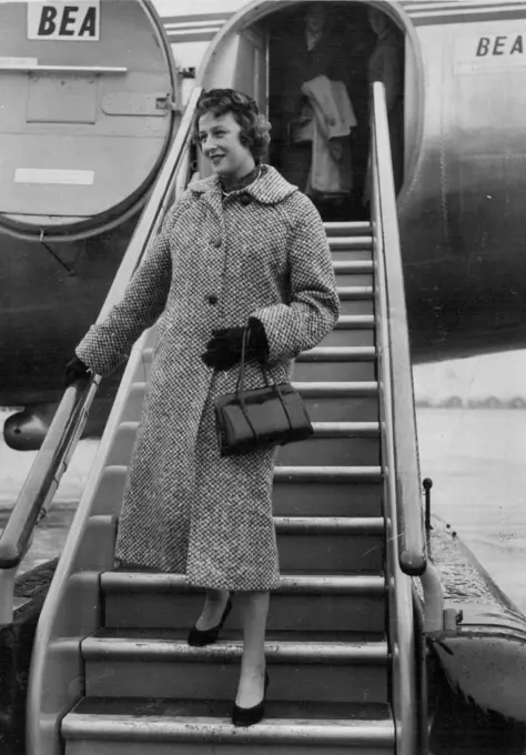 Princess Alexandra Flys in -- Princess Alexandra wearing a rust coloured hat and loose-fitting tweed coat steps from the plane at London Airport. She has justreturned from her visit to Belfast. November 25, 1954. (Photo by Daily Mail Contract Picture).