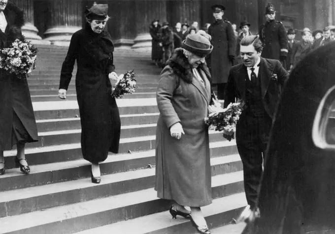 Distribution of Maundy Money At St. Paul's -- Princess Marie Louise (right) and Princess Helena Victoria leaving after the ceremony. The first coins to bear the head of King George VI were specially struck for the Maundy Thursday service held to-day at St. Paul's Cathedral, London. The silver penny, two penny, three penny, and four penny pieces are given to as many old men and women as the King has years of age - 42. March 25, 1937. (Photo by Topical Press).