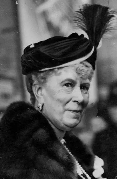 Queen Mary Attended Sale At ***** Hall -- Queen Mary leaving Kensington town hall after her visit this afternoon. Queen Mary this afternoon attended an exhibition and sale of handicrafts at the Kensington Town Hall ***** aid of the Metropolitan *****. March 23, 1938. (Photo by Keystone).