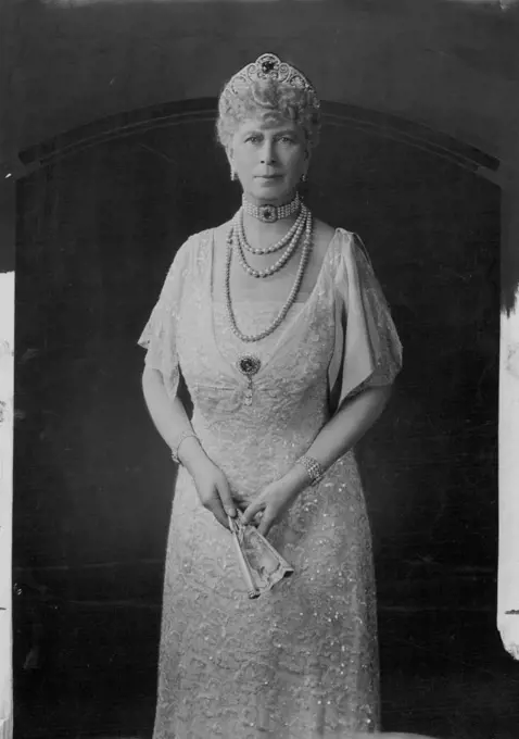 Queen Mary - 69 To-Day -- Recent Photograph of Queen Mary, who is 69 to-day. She is shown in one her favorite lace dresses - Ivory lace over an ice-blue satin slip, with an ice-blue satin bow from the shoulder. May 25, 1936. (Photo by Hay Wrightson).