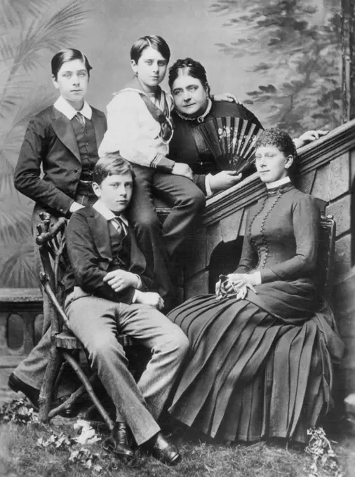 When Queen Mary Was Princess Victoria Mary -- A Picture made about 1885, showing the Princess Mary, Duchess of Teck, with her four Children. At the right, seated is Princess Victoria Mary, then Eighteen, who is now Queen Mary of England. The other children are the Late Marquis of Cambridge; the Late Princess Francis of Teck; and his Royal Highness, the Earl of Athlone. May 05, 1935. (Photo by International News Photo).