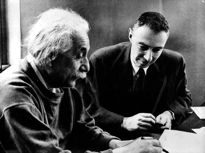 Einstein Has "Greatest Respect" For Banned Atom Scientist.
Professor Einstein (left) Tells Dr. Robert Oppenheimer about his attempts to ***** latter in ***** is of space. Picture taken in 1949 when Dr. Opponheimer was director of the institute for Advanced study at Princeton, N.J.
When told that Dr. J. Robert Oppenheimer, 49, America's foremost atomic scientist has been barred from all secret information while a new investigation was made of his supposed links with communism, Professor Einstein Said, "All I can say is i have the greatest respect and Warnest feelings for him. April 19, 1954. (Photo by Paul Popper, Paul Popper Ltd.).