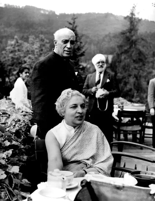 Jawarlal Nehru and His Sister Mrs. R.S. Pandit.
The Indian Prime Minister is seen with his sister, who is Indian High Commissioner in London. The photograph was taken in Austria where Mr.Nehru held a conference on India's foreign policy which was attended by his Ambassador to Europe. July 27, 1955. (Photo by Camera Press).