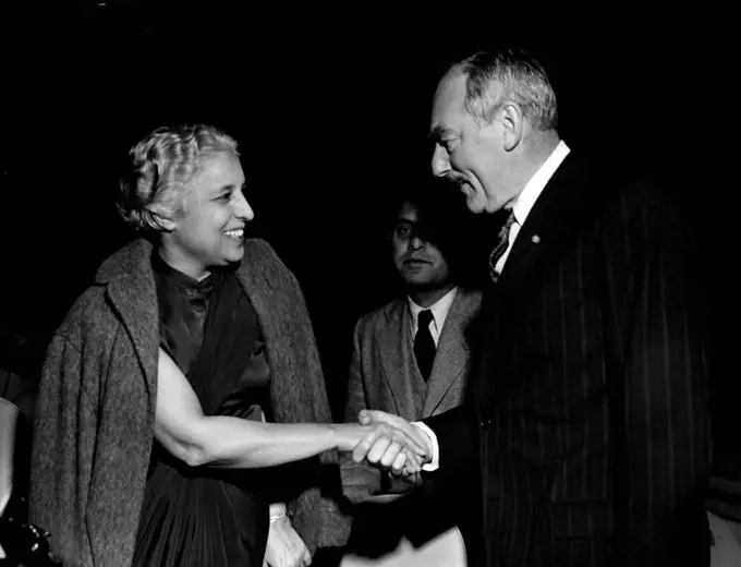 Women In The U.N. General Assembly 
Many nations have women among their top-ranking delegates to the 7th session of the United Nations General Assembly. This picture shows one of them, Mrs. Vijaya Lakshmi Pandit, Chairman of the delegation of India, shaking hands with Mr. Dean Acheson, U.S. Secretary of State. Mrs. Pandit is former Ambassador to Moscow and Washington.
October 1, 1952.