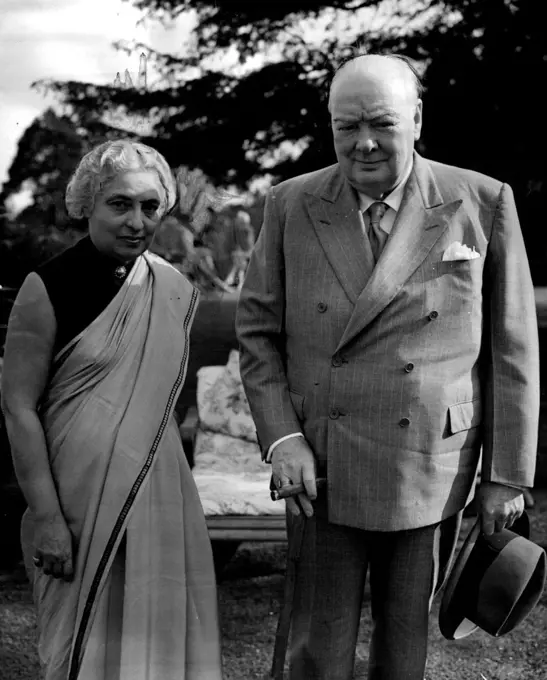 Mrs. Pandit At Chatwell Tea With Sir Winston -- Mrs. Vijaya Lakshmi Pandit, sister of Indian President of the United Nations General Assembly, had tea with Sir Winston and Lady Churchill at their Chartwell (Kent) home to-day, Sunday. Mrs. Pandit arrived in London last Monday for a week's official visit as President of the General Visit as President of the General Assembly. Her engagements have included an audience with the Queen. July 11, 1954. (Photo by Reuterphoto).