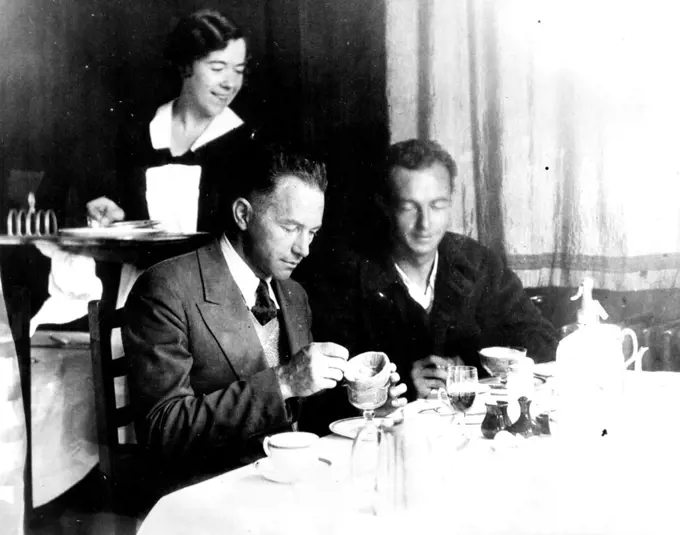 An American Breakfast On English Soil After Flying The Atlantic
Clyde Pangborn, left and Hugh Herndon enjoying their first real meal after flying across the Atlantic in their Plane "Miss Veedol". This picture was taken at Croydon where they stopped after a short visit to Wales. They remained at Croydon only a short time before continuing their attempt to encircle the world. They gave up the globe circling flight after reaching Siberia. August 07, 1931. (Photo by International Newsreel).