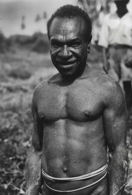 Close-up of Kai-Kai native in full dress (note shell covering). February 16, 1951. (Photo by The Sun Features Bureau).