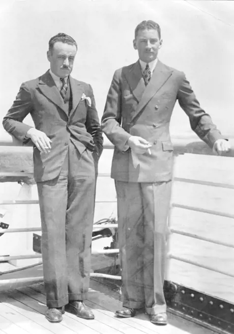 Australian Airmen Here to Buy Plane for Race - A.J. Downes (left) and H.W. Penny, noted Australian Airmen, shown when they arrived in Los Angeles aboard the S.S. Mariposa to purchase a plane for the coming $75,000 prize race from London, England to Melbourne, Australia. August 15, 1934. (Photo by Associated Press Photo).
