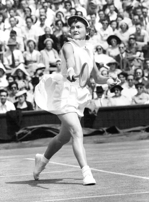 Championship Worries? - Slightly worried expression is worn by Australia's Beryl Penrose, concentrating on her Centre Court battle against wily and dangerous American Louise Brough in the women's singles of the Lawn Tennis Championships at Wimbledon, London, to-day (Friday). June 27, 1952. (Photo by Reuter Photo).