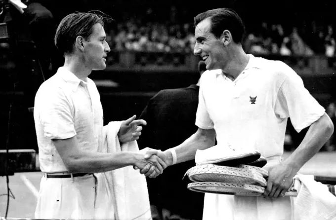 Perry Champion Still
Von Cramm (right) congratulating F.J. Perry on the court after his victory at Wimbledon today July 5.
F.J. Perry, of Great Britain, retained his Lawn Tennis championship at Wimbledon today July 5, when he defeated Baron Gottfried Von Cramm(Germany) in three straight sets in the final of the men's singles. August 19, 1935. (Photo by Associated Press Photo).