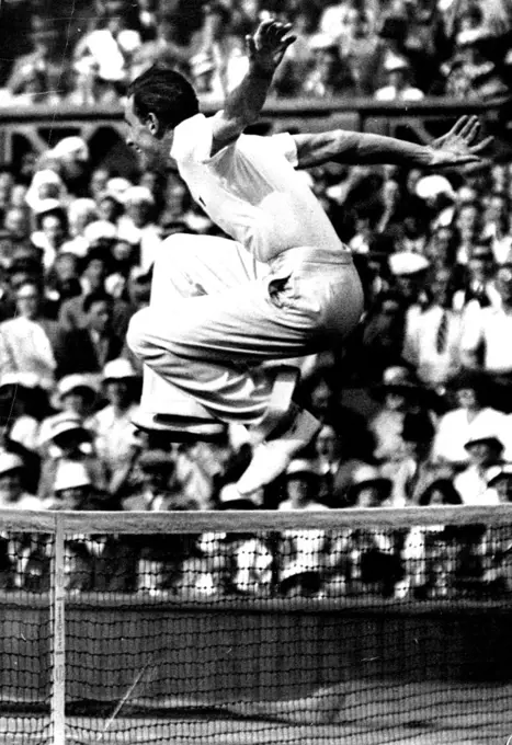 Perry's Victorious Leap!
F.J. Perry delightedly jumps the net to shake hands with his opponent S.B. Wood after their match.
Gt. Britain and Australian to meet in the finals at Wimbledon.
Fred Perry by defeating S.B. Wood (U.S.A.) July 4th., in the semi-finals of the men's singles championships at the Wimbledon tennis, now meets Jack Crawford (Australia) in the finals. August 06, 1934.