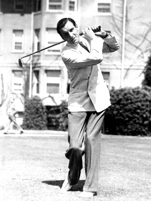 Takes Up The Other Fellow's Game
Fred Perry, Tennis Champion of the World, Plays Golf whenever he has a spare moment between tennis tournaments. Perry has been offered a large sum to turn pro, but as yet has made no decision. He only recently won the pacific southwest tennis championship for the third successive time.He is shown here playing golf in California. July 19, 1934. (Photo by Associated Press Photo).