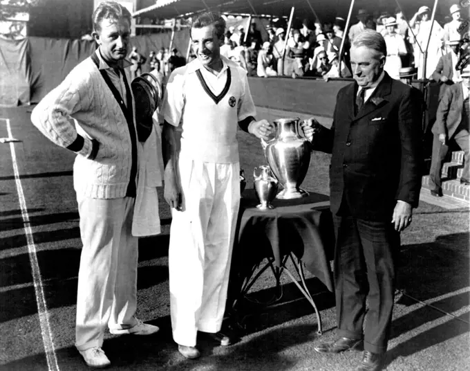 Perry Gets Coveted Cup
Fred Perry of Great Britain photographed at forest hills, N.Y., September 10 as he received the coveted U.S. singles cup from holcomb ward, President of the Eastern Lawn Tennis association. Beside him stands Jack Crawford, Australia's Premier Player. Perry won the title in five sets. Although he was hard pressed throughout. It was the first time in 30 years that England has gained this trophy. September 10, 1933. (Photo by Associated Press Photo).