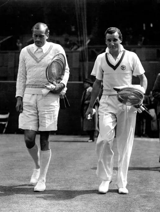 All-England Lawn Tennis Championships At Wimbledon
F.J. Perry (Great Britain) and R. Mensel (Czechoslovakia) walking on to the court for their match in the Men's Singles Championship. Perry won 0-6; 6-3; 5-7; 6-4; 6-2. January 01, 1934.
