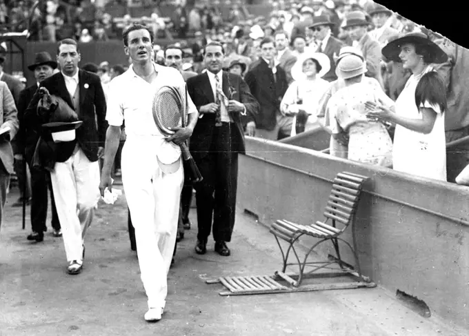 Perry Beats Cocket In Singles Of The Davis Cup Finals.
Perry leaving the courts after his victory over dochet. Rene Laceste ex-champion is shown on left. July 20, 1933. (Photo by ACME News Pictures, Inc.).