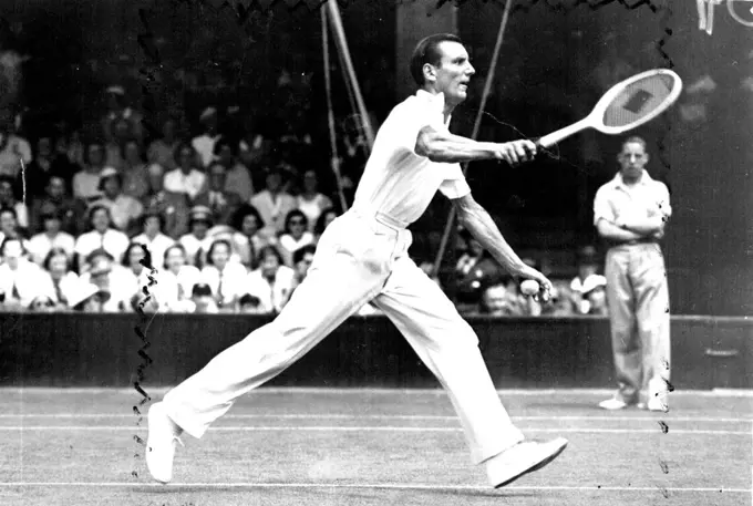 All England Lawn Tennis Championships At Wimbledon.
F. J. Perry champion in play during his ***** K. Chartikavanij (Siam) in the ***** of the Men's Singles Championship.
Fred Perry, a former champion, who thinks he could have beaten the modern net-rushers. July 27, 1936.