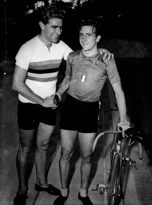 Congratulations: Aldo Gandini (right) shakes hands with Syd Patterson of Australia at Rocour Stadium, Liege, Belgium, Aug. 15, after Patterson had beaten Gandini in the final of the world Amateur Pursuit championship. Second place went to Gandini. Patterson's time was five minutes 12.1 seconds against Gandini's five minutes 13.1 seconds. Patterson wears the champion's sweater, colored with red blue yellow green and black bands on a white base. August 23, 1950. (Photo by Associated Press Photo).
