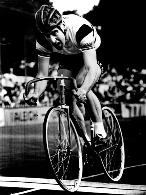 This man means business. He is Sid Patterson, Australian cyclist, in action at Herne Hill yesterday. He set up two British Professional records - mile and half-mile unpaced flying start.
The Notable Smile is missing when he's breaking records. May 19, 1952.