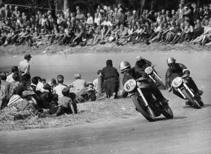 Duke wins in Germany - In the 350 cc event Geoffrey Duke (60) leads Johnny Lockett (65), of Britain who was second, and Ken Kavanagh of Australia (70) who was third. All are driving British Norton machines.British Geoffrey Duke set two new track records at the ***** race course near Stuttgart, August 26, when he won both the major events of the German motor-cycle Grand Prix. He won the 500 cc event at an average of 136 kmph (about 84.5 mph) and the 350 cc event at 130.6 kmph (about 81 mph). September 8, 1951.