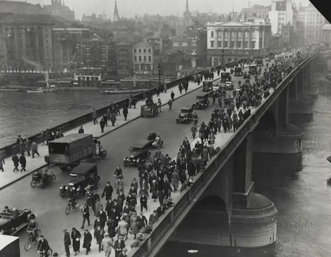 The General Strike -- How thousands of people walked to walk in the City. A scene during the great strike, showing hundreds walking to work across one of London's main bridges. August 3, 1936.