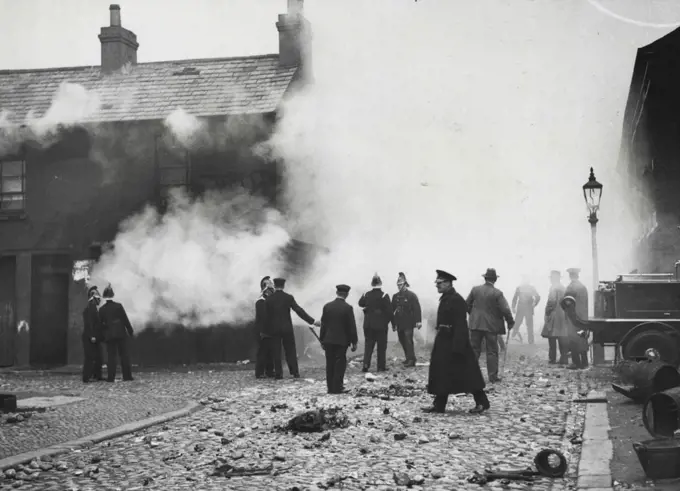 The Riots in Belfast -- The burning of a looted shop off York Street. November 21, 1932. (Photo by Central News).