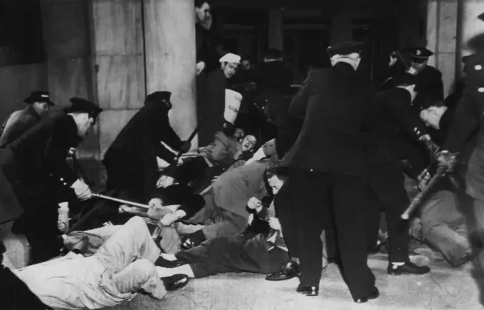 Police Try To Remove Prone Pickets -- Police try to remove pickets at the New York Stock Exchange here today after the pickets stretched flat on the sidewalk before the 11 Wall street entrance to the Exchange in an outbreak of violence in the financial employees strike against the stock exchange and New York Curb exchange. March 30, 1948. (Photo by AP Wirephoto).