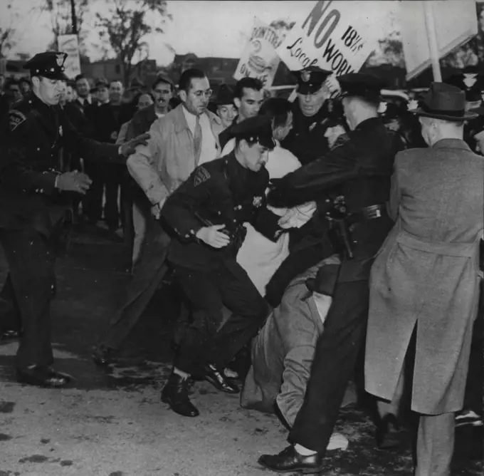 Violence At West Hartford Strike -- Police and strikers tangle as violence of breaks out at the Pratt-Whitney aircraft plant at West Hartford, Conn., 13. The disturbance started when persons described by company spokesmen.As workers sought to enter the plant by walking through picket lines. May 31, 1946. (Photo by Associated Press Photo).