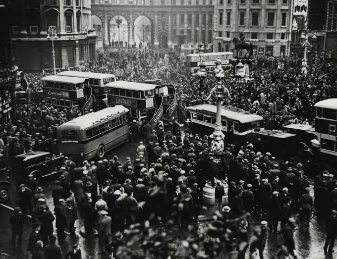 A traffic block caused by the crowd watching the hunger marchers demonstrating in Trafalgar Square. December 12, 1932.