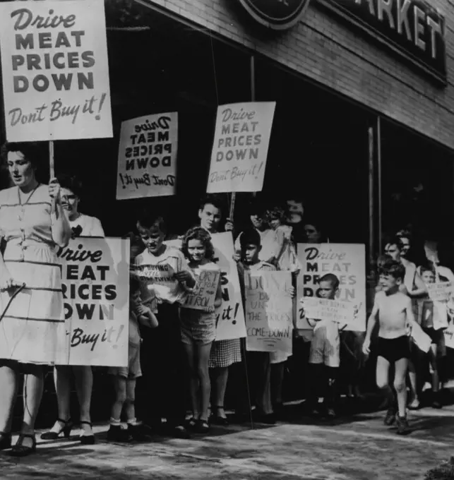 Picket for lower meat prices. Housewives and children are shown (above) picketing a chain store here today in an attempt to reduce week-end meat purchases in a protest against higher prices. July 19, 1946. (Photo by AP Wirephoto).