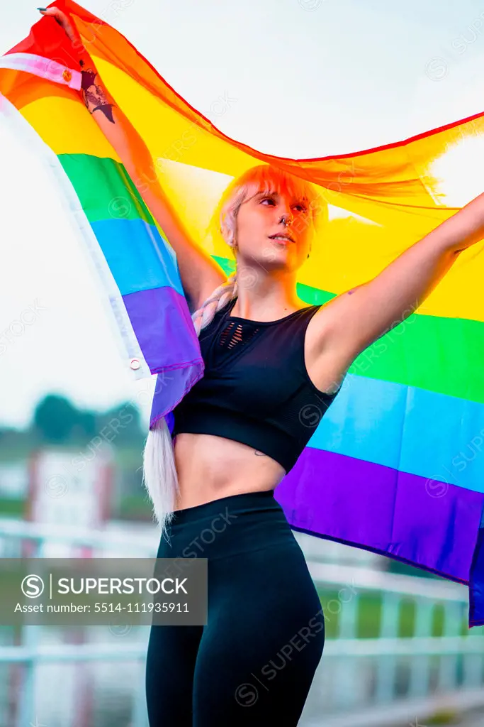 Young woman with a rainbow flag