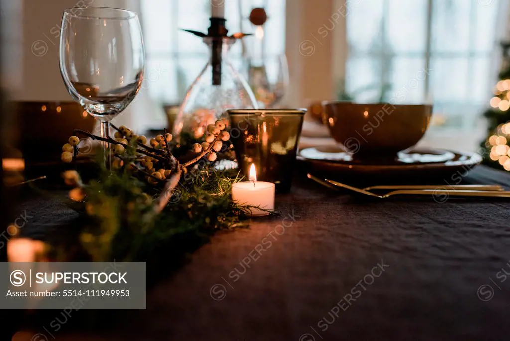 Scandinavian tea light candle on a decorated dinner table setting