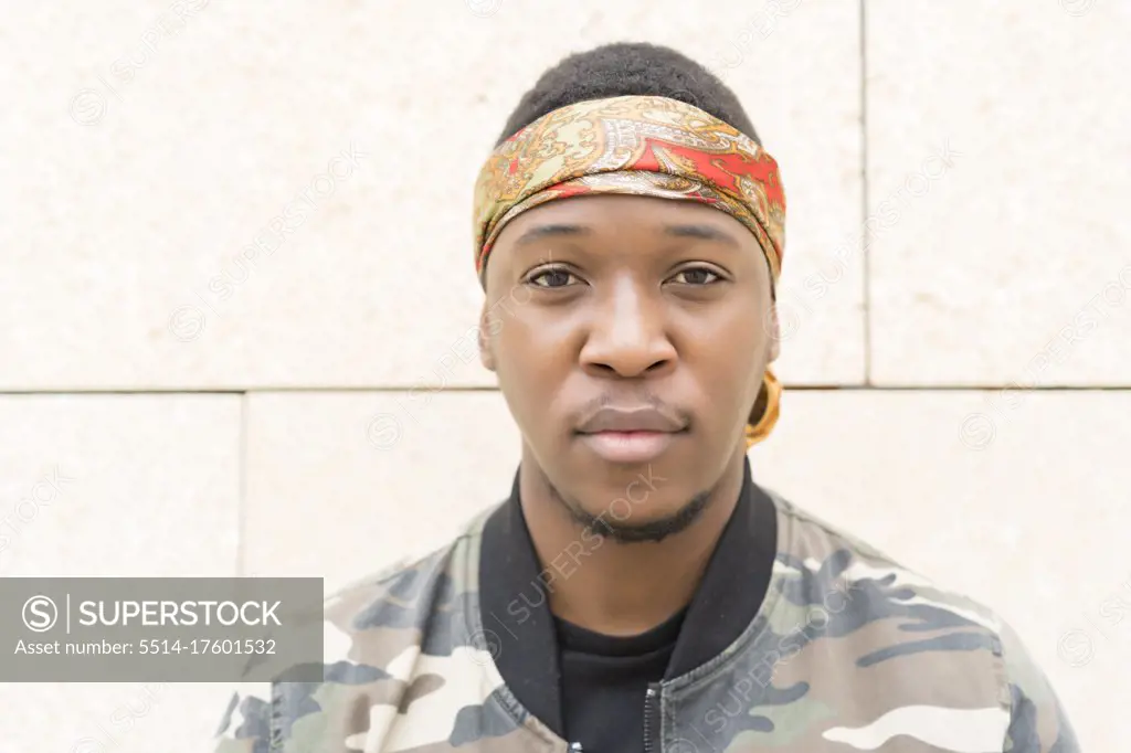 portrait of young african man with headscarf