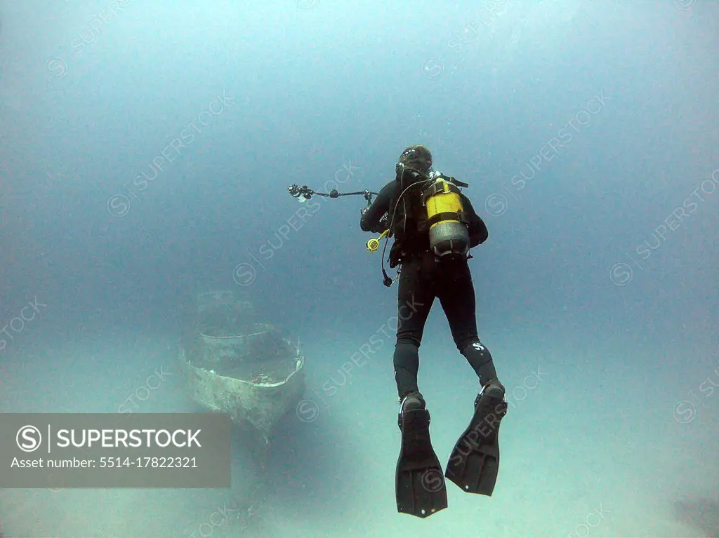 The diver moves towards the wreck to take pictures. Antalya Turkey