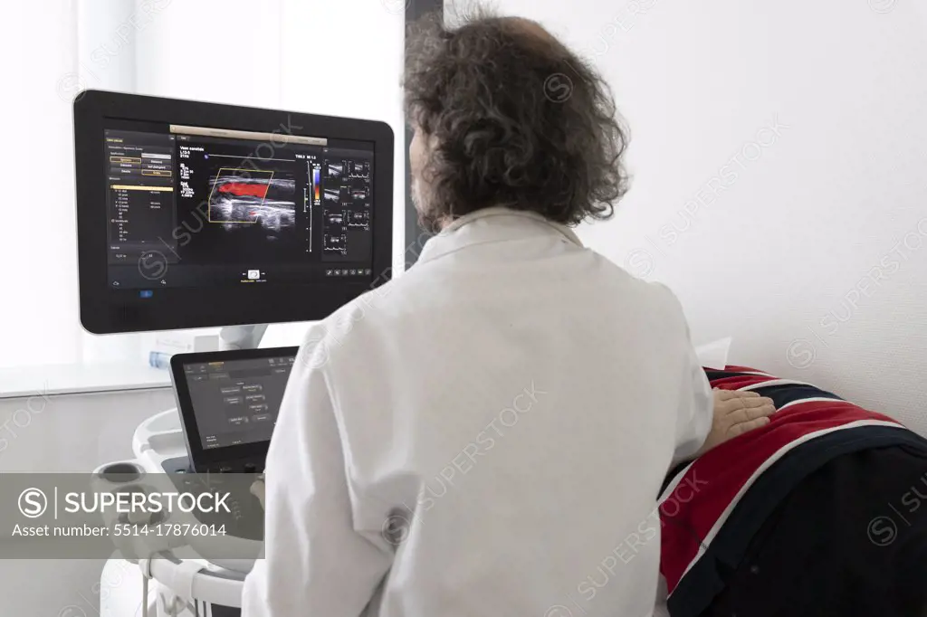 a neurologist gives an ultrasound to a patient