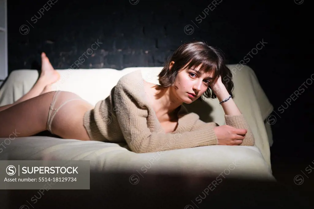 woman lying on the couch in panties