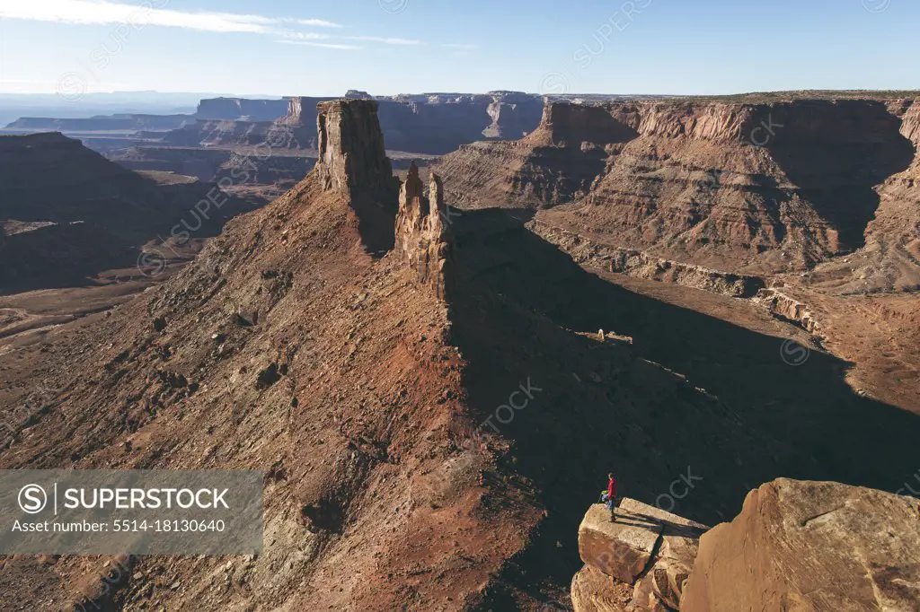Man standing on rocky cliff at Canyonlands National Park