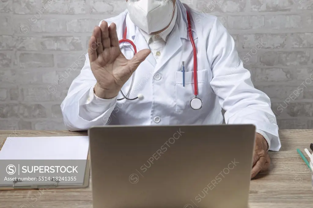 Patient doctor consultant using video chat in clinic.