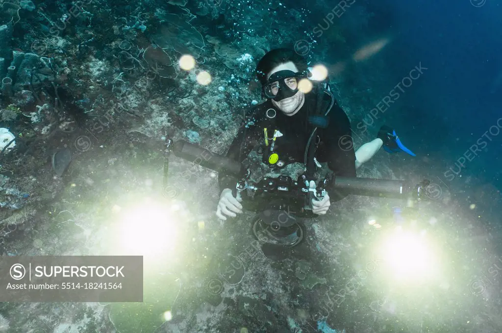 underwater photographer looking at camera in Raja Ampat