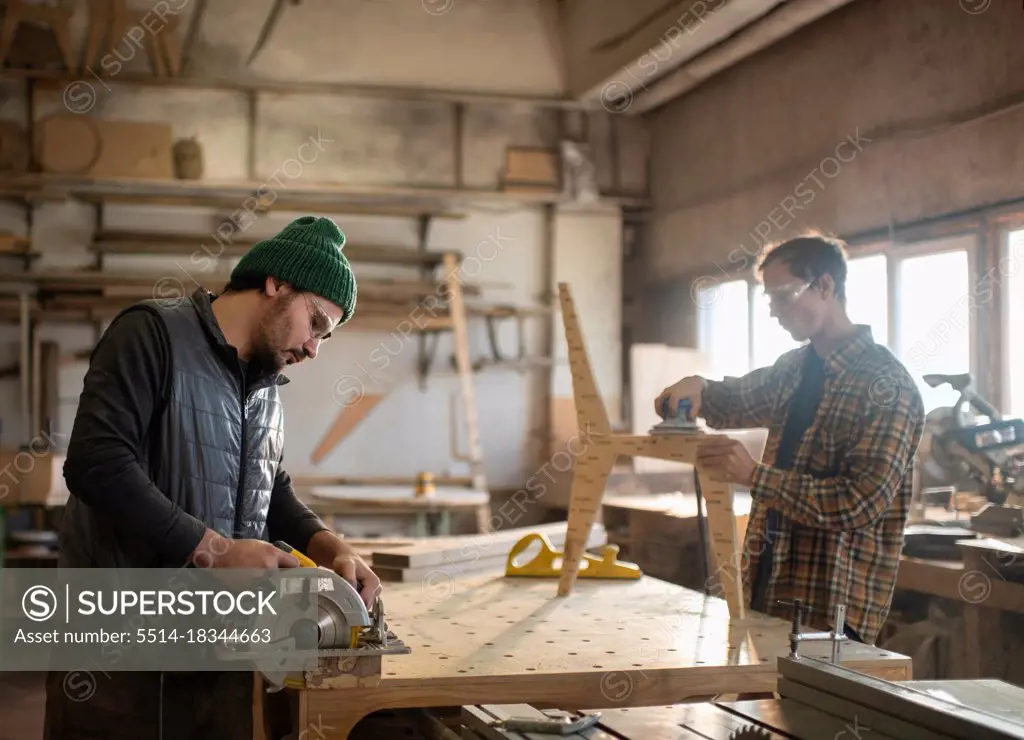 Male carpenters working in workshop
