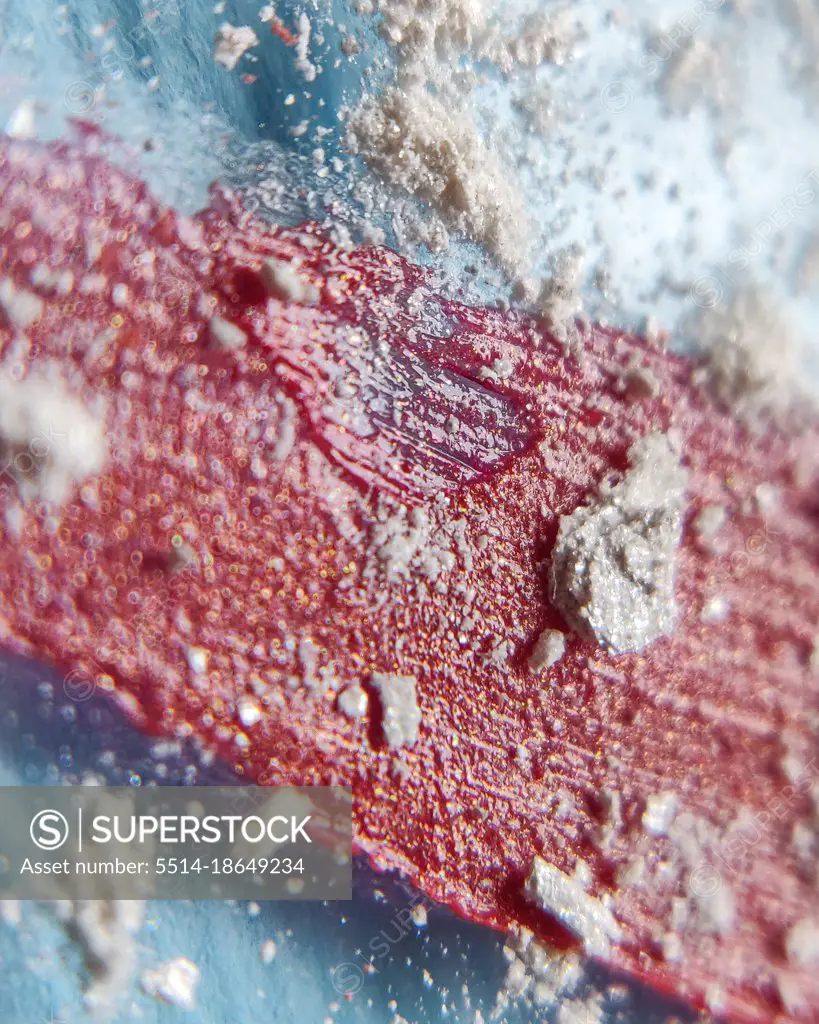 Close-up of lipsticks for lips on top of scattered shadows