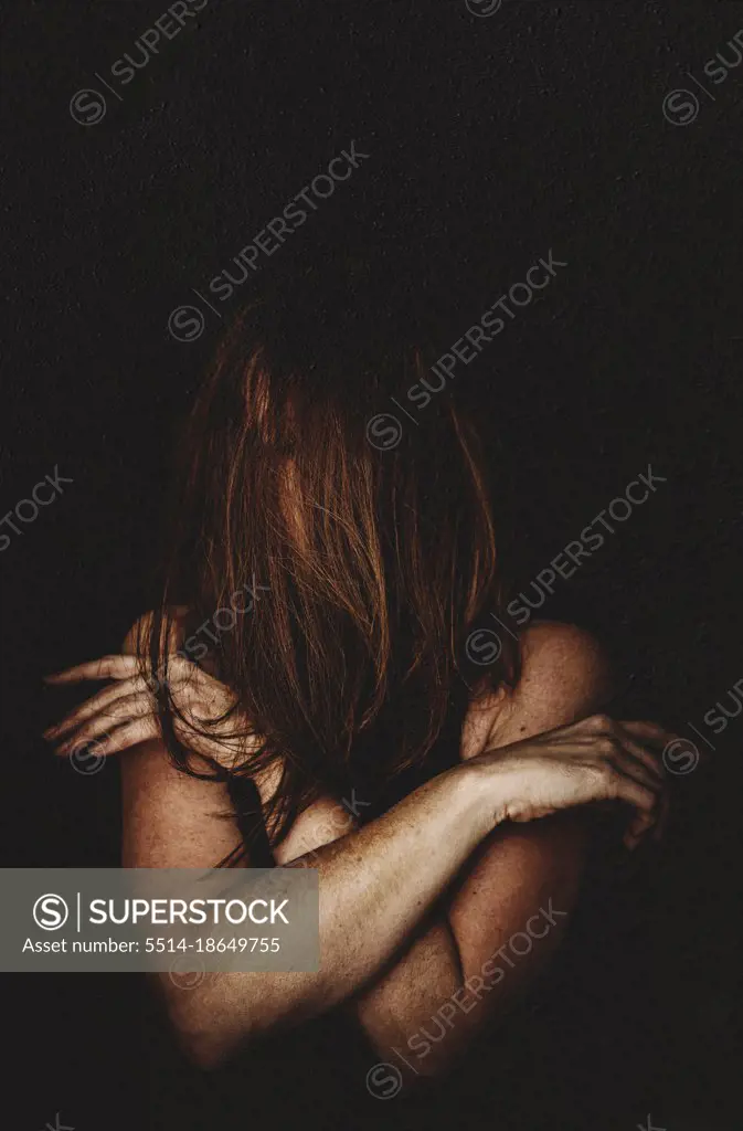 Portrait of woman with hair covering her face