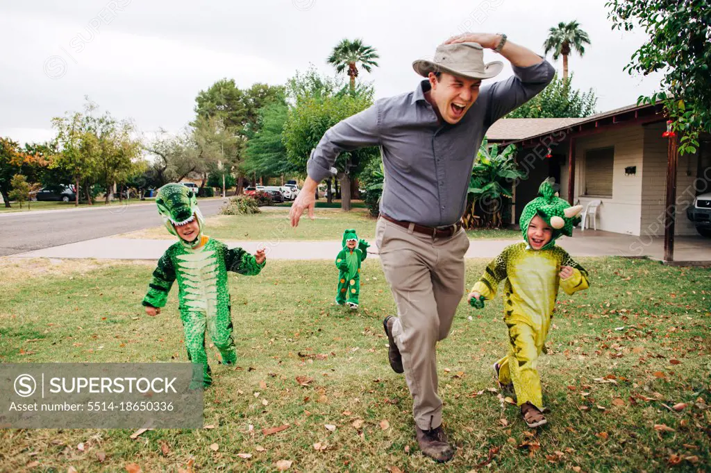 Dad runs from kids dressed as dinosaurs on Halloween