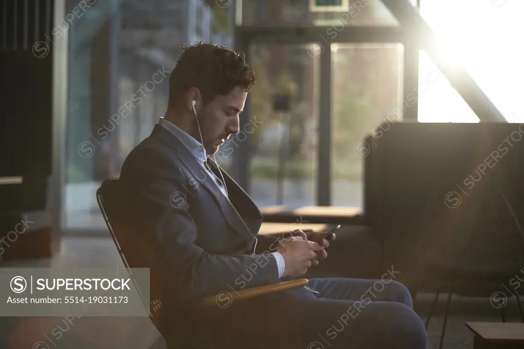 Man wearing a suit waiting for his job interview