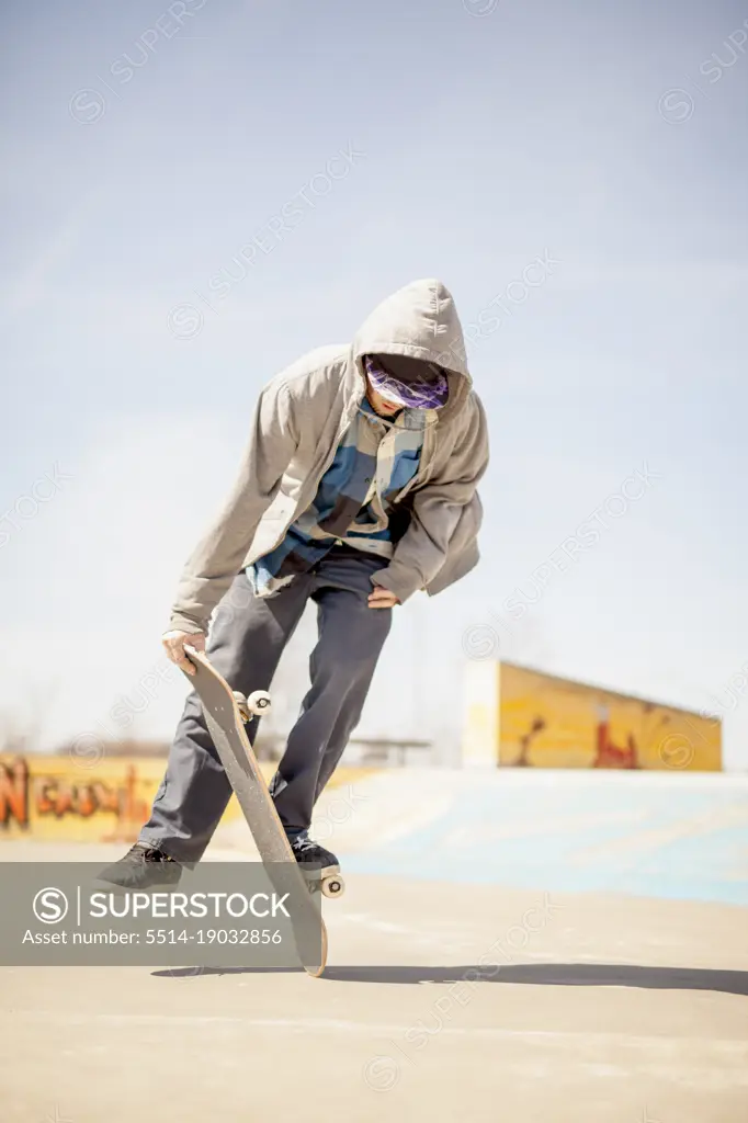 Young skateboard enthusiast doing old school tricks