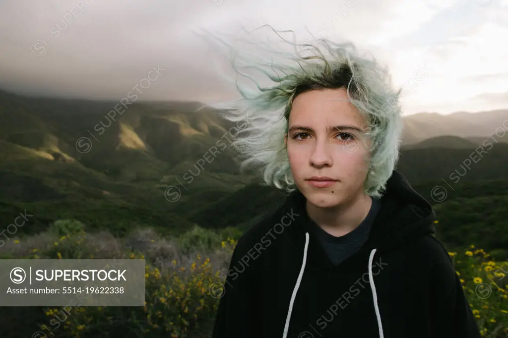 Wind Blown Blue Haired Teen Girl Outside In Nature