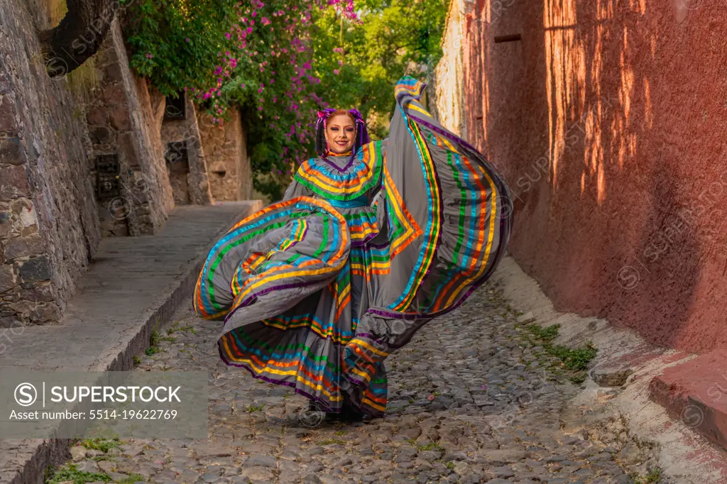 Mexican girl with folk costume for traditional mexican mariachi dance