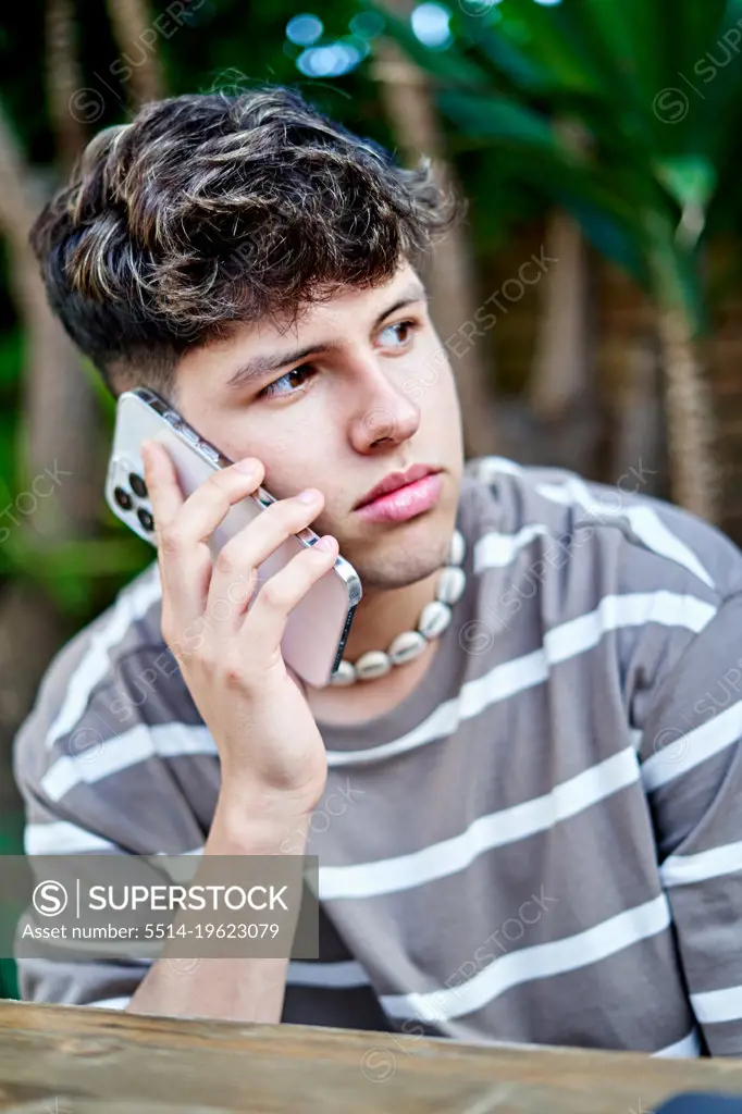 a young boy using the mobile phone
