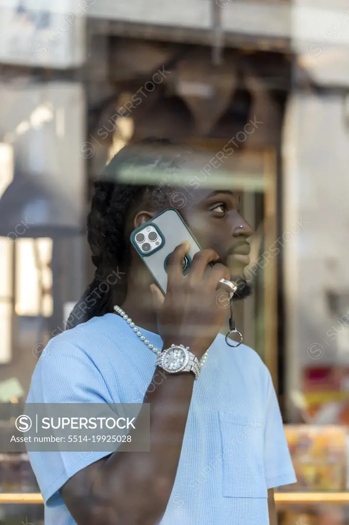 African in a phone conversation from his smartphone