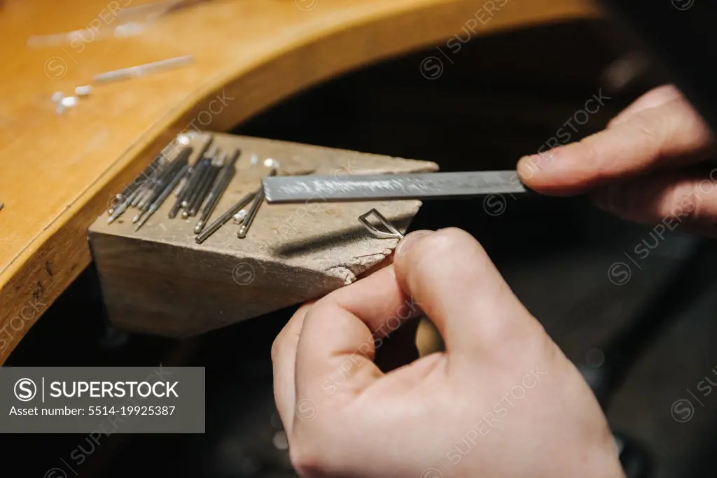 jeweler making silver jewelry close-up