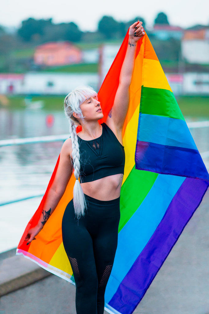 Lesbian girl holding LGBT flag